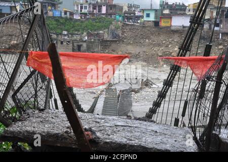 India Disaster. Heavy rainfall causes flood. Broken a river bridge. Cause harm to many lives. Cloudburst in India. Stock Photo