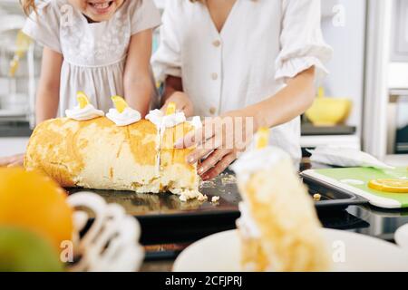 Cutting homemade biscuit roll Stock Photo