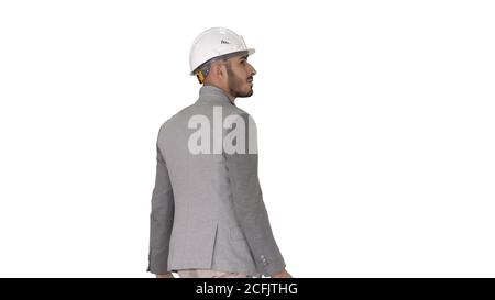 Engineer in helmet with briefcase walking on white background. Stock Photo
