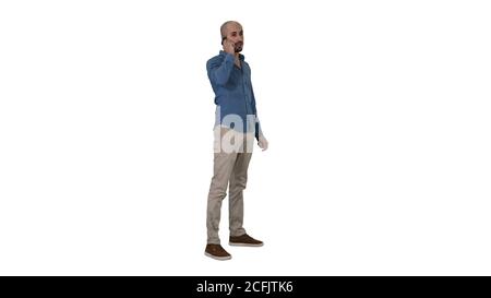Serious arab talking on the phone on white background. Stock Photo
