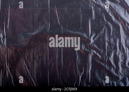 Texture of black crumpled garbage plastic bag. Abstract background for design Stock Photo