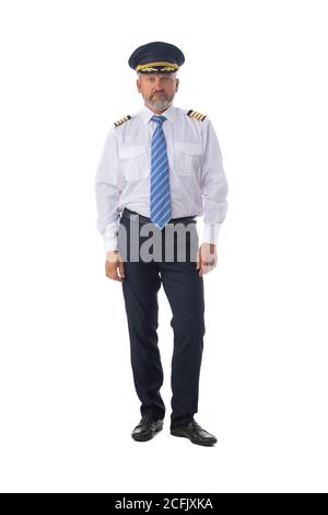 Airline pilot wearing the four bar Captains epaulettes, firlst pilot, aircraft commander, isolated on white background, full length portrait Stock Photo