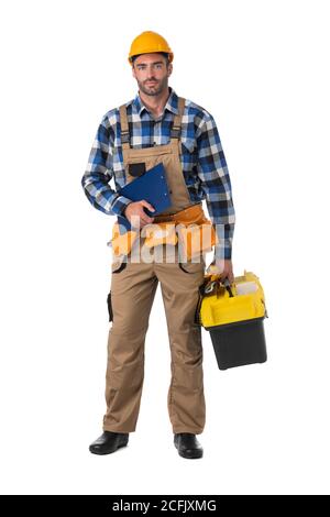 Contractor worker in coveralls and hardhat with toolbox and document folder isolated on white background, full length portrait Stock Photo