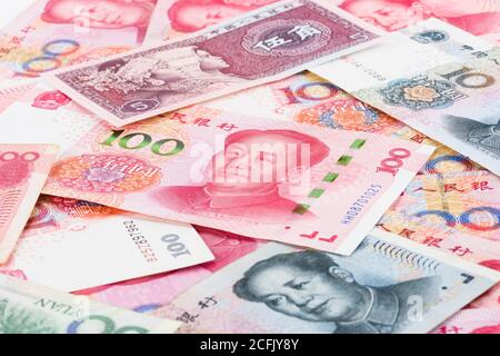 Background collage of Chinese Rmb bank notes or Yuan with Chairman Mao ...
