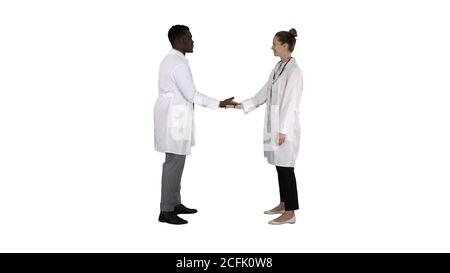 Successful team of surgeons giving high five and laughing isolated on white background on white background. Stock Photo