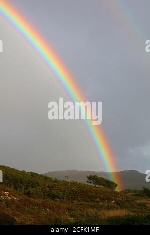 A Rainbow over Duirinish and Plockton on a Stormy Evening, West Highlands, Scotland, UK. Stock Photo