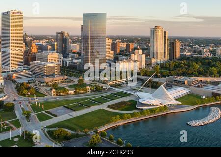 Milwaukee, WI - 3 September 2020:  Image from a drone of the Milwaukee skyline from lake Michigan during sunrise including US Bank, Milwaukee Art Muse Stock Photo