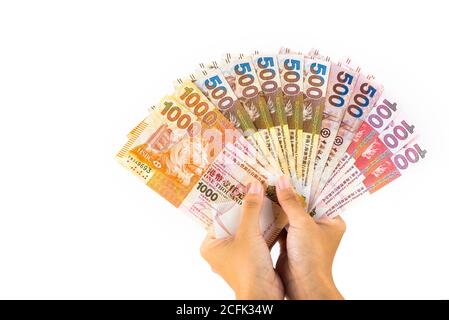 asian hand hold hong kong banknotes money Stock Photo