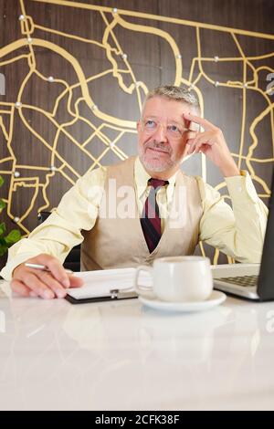 Man working on business plan Stock Photo