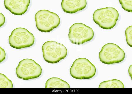 Cucumber slice pattern isolated on white background. Cucumis sativus backdrop Stock Photo