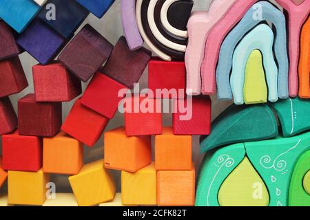 Nice arranged blocks. Wooden toys. Rainbow colors combined with pastels and black and white. Stock Photo