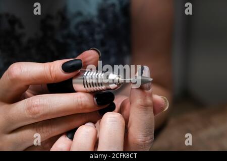 Hardware manicure, removing gel polish from nails at home Stock Photo