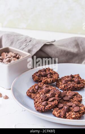 Some sugarfree freshly baked oatmeal and banana cookies. Vertical image. Stock Photo