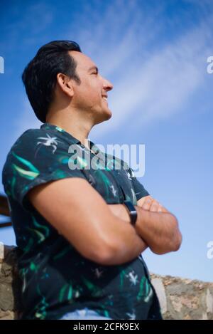 Man with positive and thoughtful attitude in an outdoor location. Stock Photo