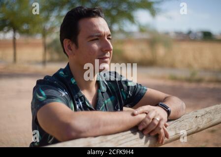 Man with positive and thoughtful attitude in an outdoor location. Stock Photo