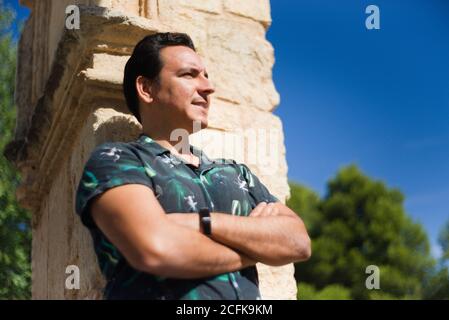 Man with positive and thoughtful attitude in an outdoor location. Stock Photo