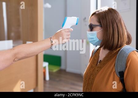 Gun electronic medical thermometer measuring Handheld Forehead Readings  diagnostic display shows the result of the body temperature measurement  36.6 C Stock Photo - Alamy