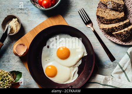 Fried egg. view of two fried eggs on a frying pan. ready to eat with breakfast or lunch Stock Photo