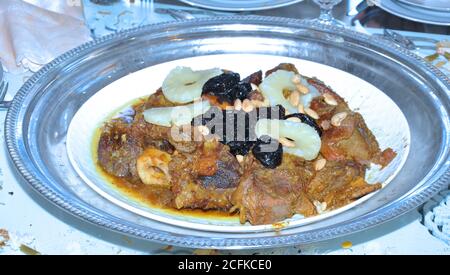 Moroccan tagine with meat, pineapple and dried plum. One of the most famous dishes in Morocco and the world. Stock Photo