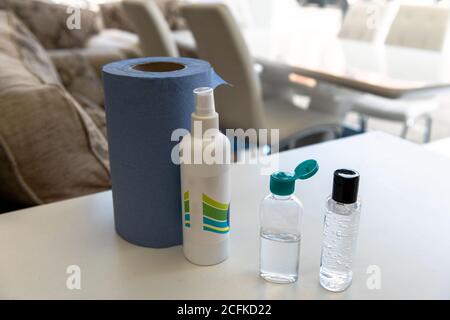 Hand sanitizer by the entrance of a small business as required under government rules due to the Covid-19 pandemic. Stock Photo
