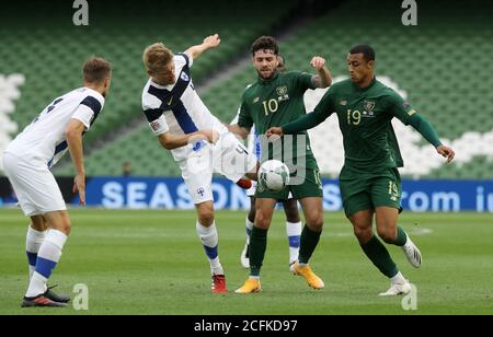 Republic of Ireland's Robbie Brady (2nd right) and Adam Idah (right) battle with Finland's Juhani Ojala (2nd left) during the UEFA Nations League Group 4, League B match at Aviva Stadium, Dublin. Stock Photo