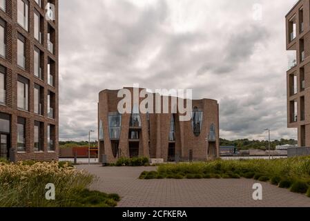 The iconic Fjordenhus between two houses in the harbour basin of Vejle, Denmark, June 9, 2020 Stock Photo