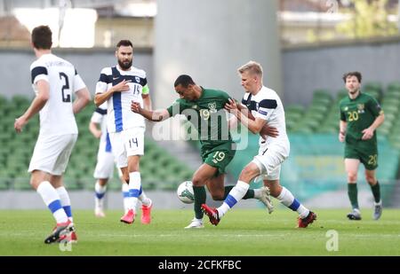 Republic of Ireland's Adam Idah (centre) and Finland's Juhani Ojala (right) battle for the ball during the UEFA Nations League Group 4, League B match at Aviva Stadium, Dublin. Stock Photo