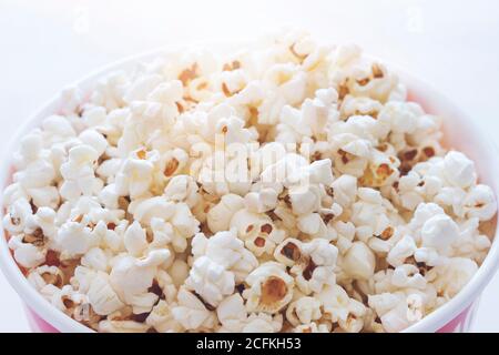 Popcorn in striped box on white background Stock Photo