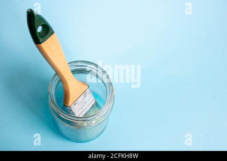 Brush with color paint in glass of water, isolated on white Stock Photo -  Alamy