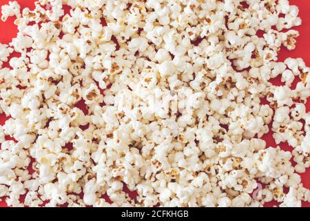 Close-up popcorn on red color background Stock Photo