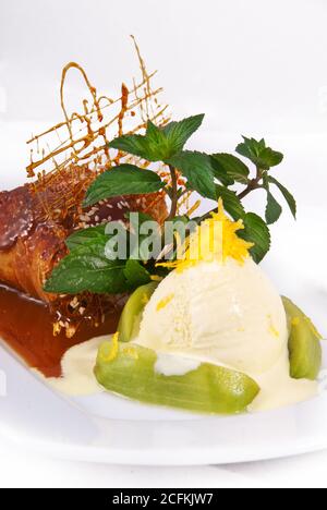 Ice cream with caramel on a plate Stock Photo