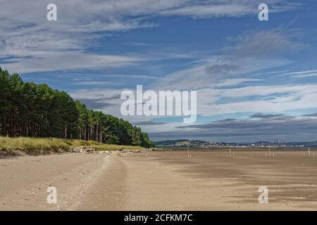 Looking past the Fishing Fence line of the Tay Estuary next to Tentsmuir Forest, and beyond to Tayport and the Port of Dundee. Stock Photo