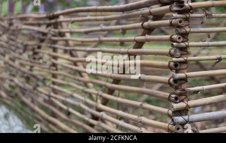 close up bamboo wood fence with irontexture interior background from nature in agriculture life style Stock Photo