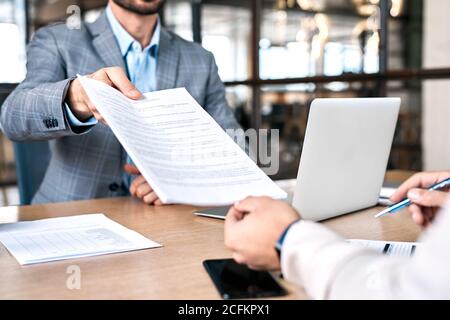 Two businessman checking paper document in office Stock Photo