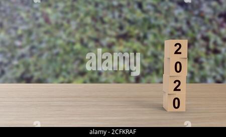 2020 numbers word Wooden cubes on table vertical over background leaves green HD, mock up, template, banner with copy space for text, Happy New Year d Stock Photo