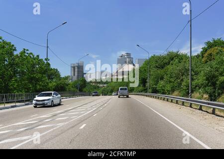 Russia, Krasnodar region, Verkhnebakansky settlement-June 12, 2018: view of Verkhnebakansky cement plant from the side of the A146 highway Stock Photo