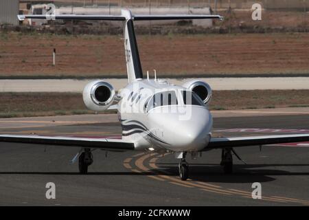 Cessna Citation Mustang small private jet taxiing on arrival in Malta. Close up view from the front. Corporate air travel. Stock Photo