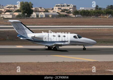 Cessna Citation Mustang small business jet taxiing on arrival in Malta. Side view. Stock Photo
