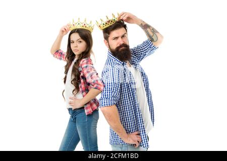 Sorry we are cool. Sorry we are cool. Cool daughter and father wear crowns. Little child and bearded man with cool look. Super family. Luxury and chic. Believe in yourself.