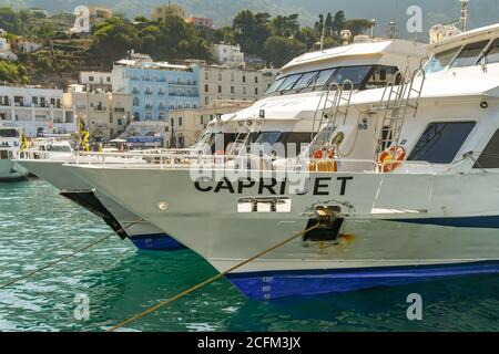 ISLE OF CAPRI, ITALY - AUGUST 2019: Passenger ferries in port on the Isle of Capri. Stock Photo