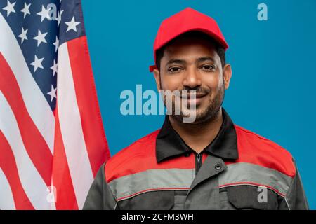 Young successful mixed-race worker or repairman standing in front of camera Stock Photo