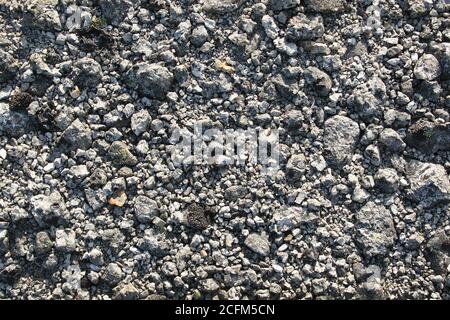 Crushed stone background. Small rocks on a mountain trail underfoot Stock Photo
