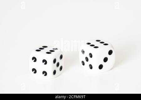 Traditional dice or die against white background. Luck, lucky, roll of the dice, luck of the draw, take a chance, Stock Photo