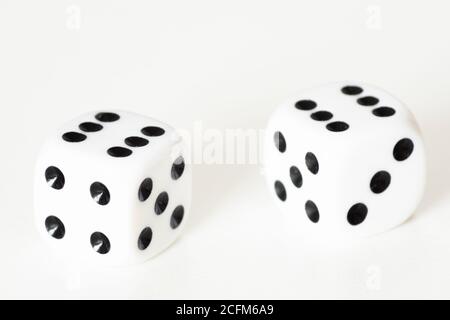 Traditional dice or die against white background. Luck, lucky, roll of the dice, luck of the draw, take a chance, Stock Photo