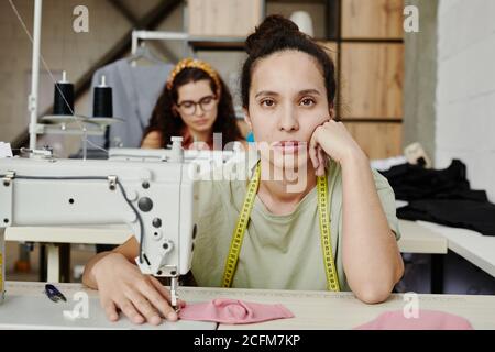 Beautiful And Young Seamstress With A Measuring Tape On Her Neck Stock  Photo, Picture and Royalty Free Image. Image 141299431.