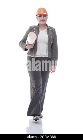 female architect with a roll of drawings striding towards you Stock Photo
