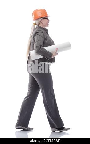 female architect with a roll of drawings striding towards you Stock Photo