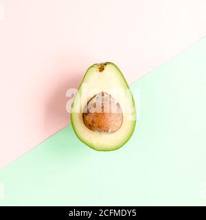 Board frame and summer tropical fruits: orange, lemon, lime, mango on pink background. Food concept. flat lay, top view Stock Photo