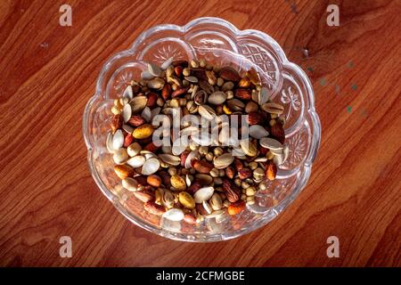 Top shot of a  dry fruits bowl on a table Stock Photo
