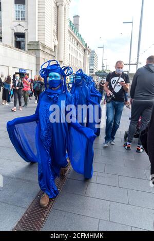 Protesters wear blue outfits to represent the ocean during the demonstration.The groups of Extinction Rebellion Marine, Ocean Rebellion, Sea Life Extinction and Animal Rebellion marched in London in a ‘socially distanced grief march’ to demand protection for the oceans and in protest against global governmental inaction to save the seas due to climate breakdown and human interference, and the loss of lives, homes and livelihoods from rising sea levels. Stock Photo